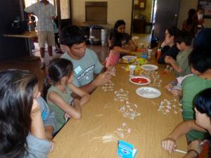 A UH Manoa graduate student demonstrates one of the activities at the 2010 Moloka‘i Math Day.