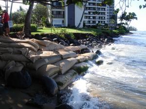 Example of chronic coastal erosion threatening a building on Maui. Credit: Zoe Norcross-Nuu.