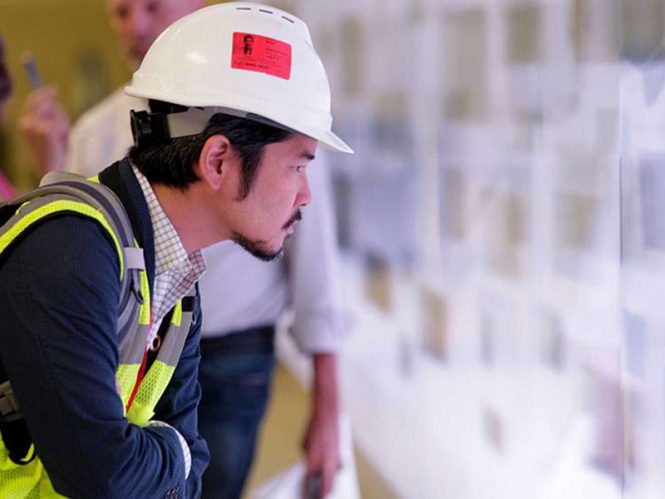 Portrait of Mat Kubo in profile with construction hat on