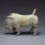 Photograph of a horned beast sculpture from a Chinese tomb
