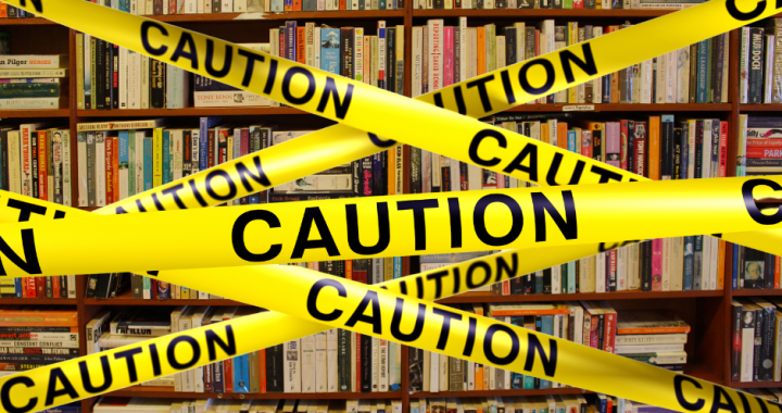 caution tape on bookshelves