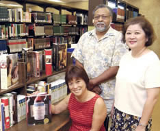 Fern Tomisato, Dave Coleman and Diane Sakai with donated books