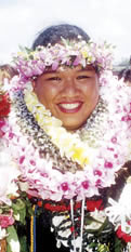 graduate with many lei
