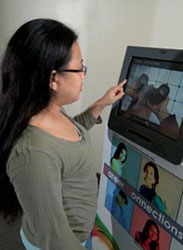 student using touch-screen kiosk