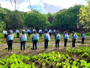 Students are adorned in traditional kīhei (garment) they dyed by hand.