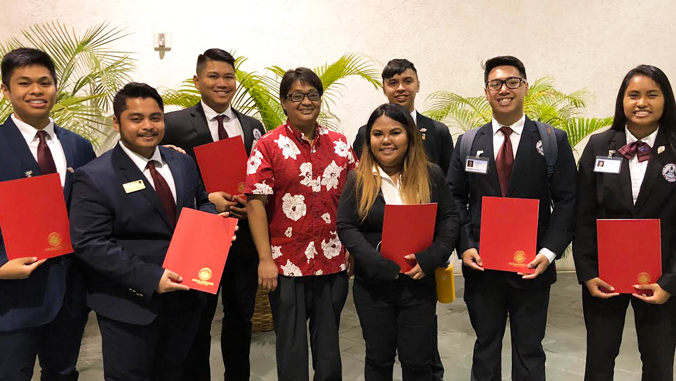 U H Hilo students holding H O S A awards