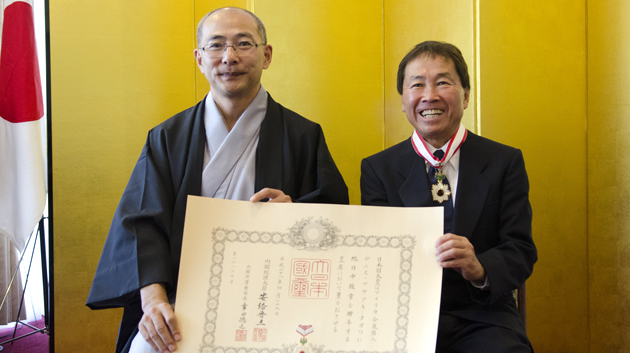 two men holding poster