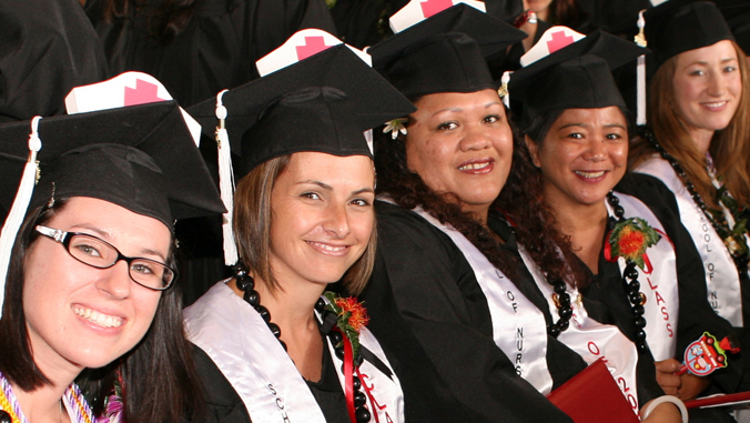 nursing students at graduation wearing cap and gown