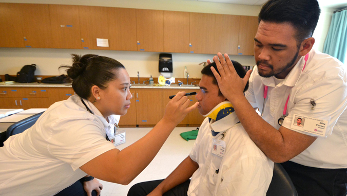 Students practicing their emergency medical technician skills.