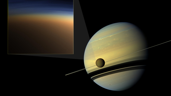illustration of Saturn and Titan and an addition illustration of the haze around Titan