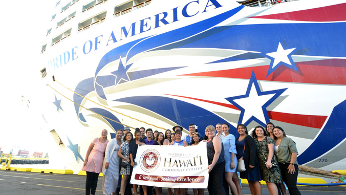 students and teachers posing in front of cruise ship