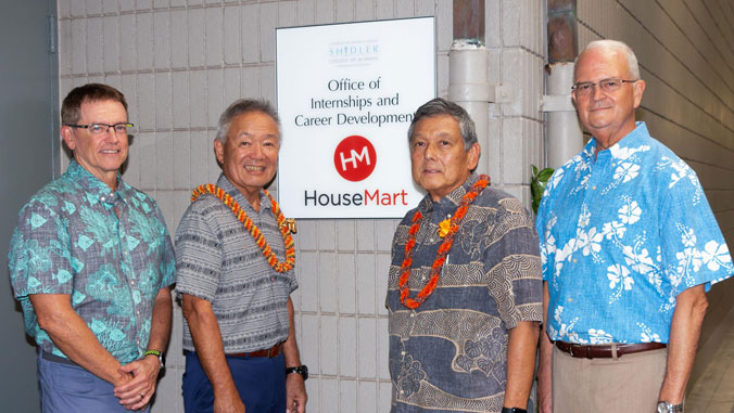 men in front of sign