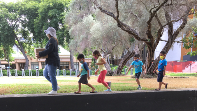 adult and children walking