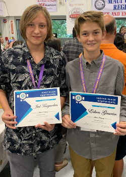 Two boys with awards