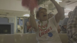 woman cheering with pom poms