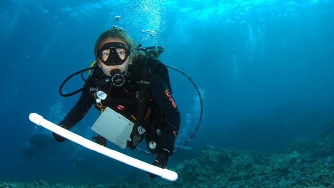 Alexa Runyan in scuba gear underwater