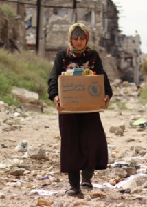 woman holding box of food