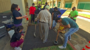 people helping to build concrete ramp