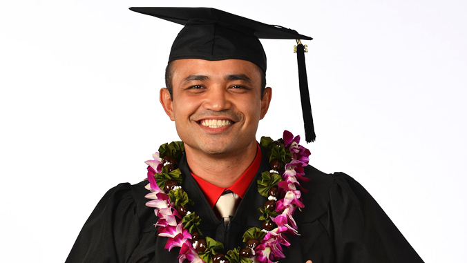 man wearing graduation cap and gown