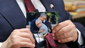 Hands holding a photograph