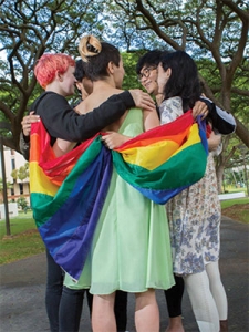 group with a pride flag