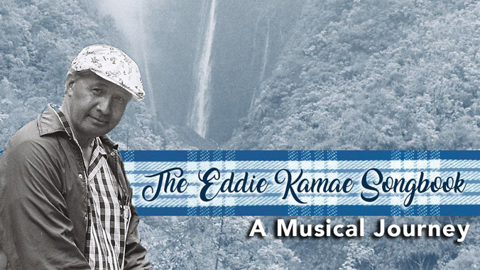 Eddie Kamae in front of a waterfall