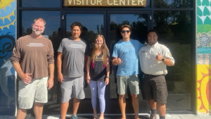 five people posing for a photo