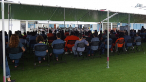 people sitting under a tent