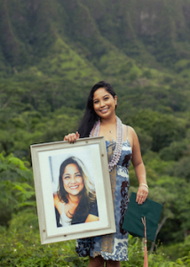 laforga smiling and holding up a photo