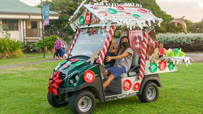 Person on a decorated golf cart