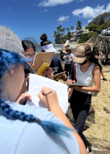 students conducting research on beach