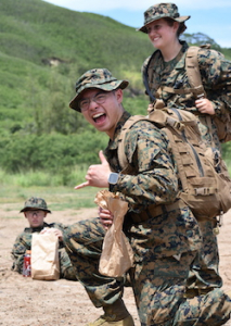 midshipman smiling with shaka