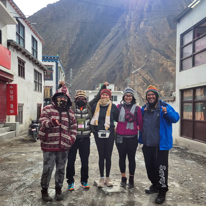5 people standing in road in Nepal