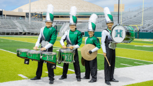 people in green uniforms with drums and cymbals