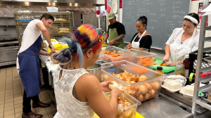 People prep vegetables