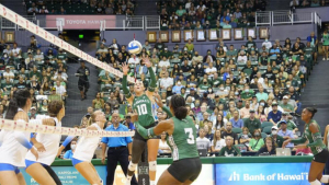 Kate Lang setting a volleyball