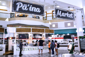 Paina Market sign over food serving counter