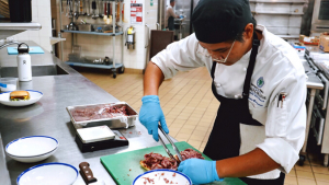 person preparing food in a kitchen