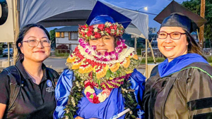 Three people at graduation