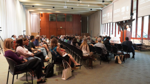 people sitting in a conference hall