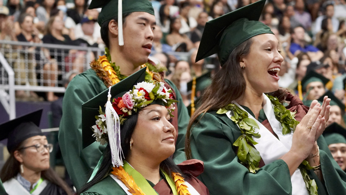 people with graduation caps and gowns