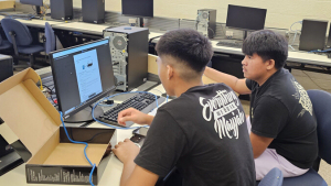 Two students at a computer