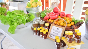 table with honey, fruit and vegetables