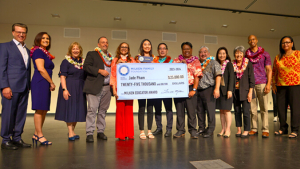 people standing with a large check