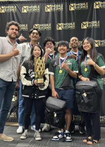 people standing holding a trophy