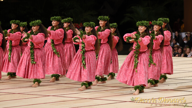 Wahine hula dancers dancing at the Merrie Monarch.