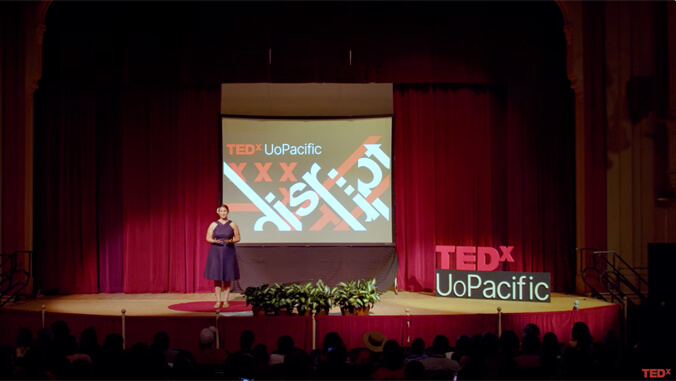 Sarah Vogel on stage at her TEDx talk