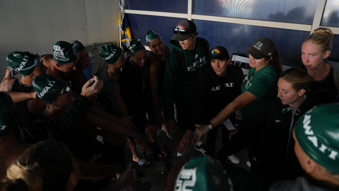 water polo team in a huddle