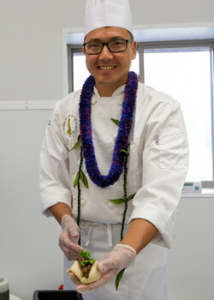 Culinary student holding bao bun