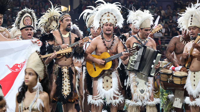 People in traditional dress performing music